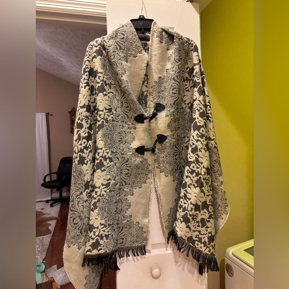Women’s cream/black shawl with buttons. One size